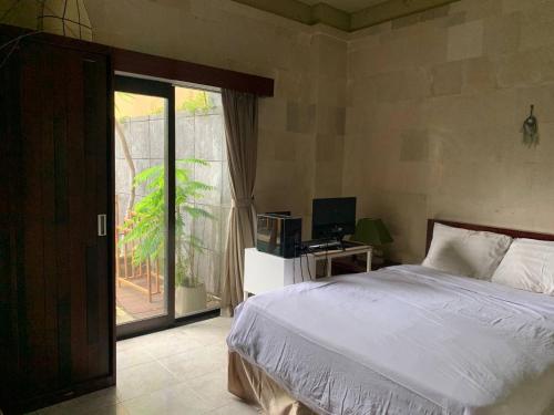 Postel nebo postele na pokoji v ubytování Cozy Palm Villa