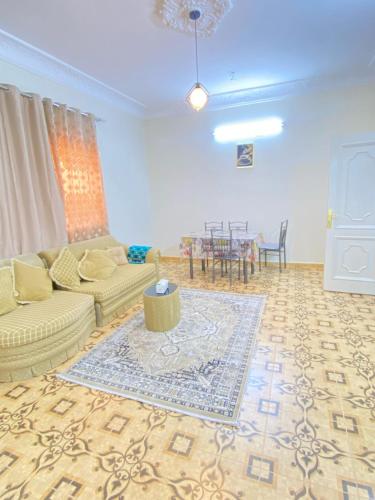 a living room with a couch and a table at نزل القمريه in Taif