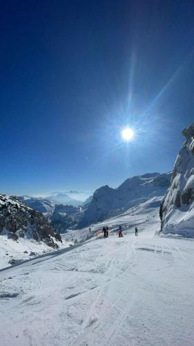 a group of people skiing down a snow covered slope at Landhaus Seppi in Presseggersee
