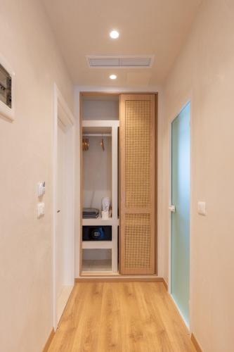 an empty hallway with a door to a room at Dimitri Hotel in Himare