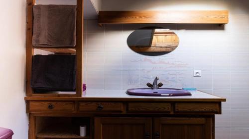 a bathroom with a sink and a mirror at Chalet Belvedere-vallouise - Chalet avec vue sur Vallouise 9 personnes MAE-2424 in Vallouise