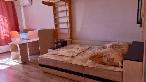 a bedroom with a bed in a room with boxes at Чорноморськ Квартира на парковій in Chornomorsk