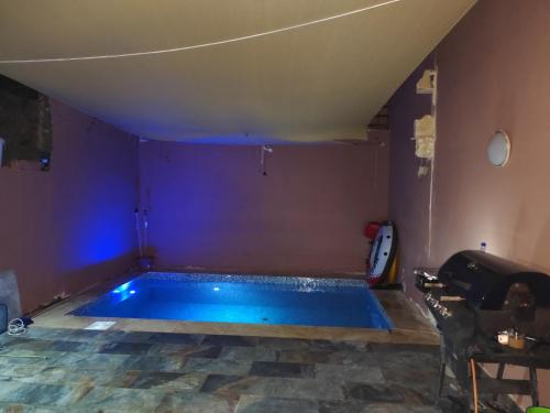 a swimming pool in the middle of a room at Sharel in Msida