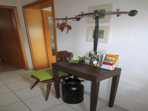a desk with a lamp and a chair in a room at Vulkaneifel Garden Retreat in Daun