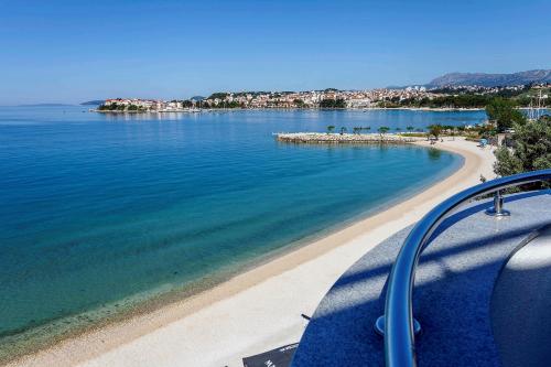 a view of a beach and the ocean at Sunset Split Rooms in Podstrana