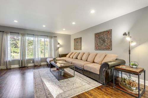 a living room with a couch and a table at half Mi to Creation Museum Home with Large Yard! in Petersburg