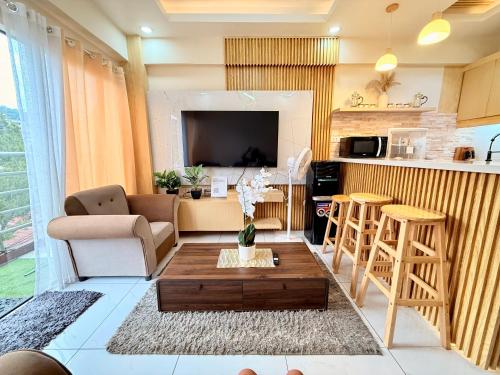 a living room with a couch and a table at 2BR Across Burnham Park Baguio Transient - Unit G in Baguio