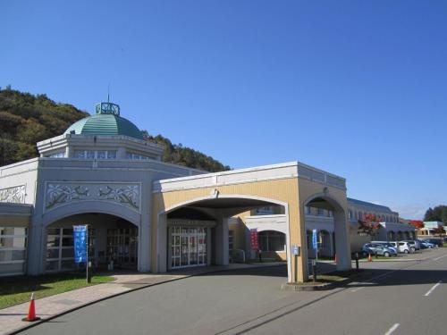a large building with a green dome on a street at Yusenkaku - Vacation STAY 94305v in Kombu