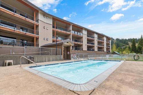 a large swimming pool in front of a building at THE CLYDE - Your Cozy & Luxurious Mt Hood Retreat in Government Camp