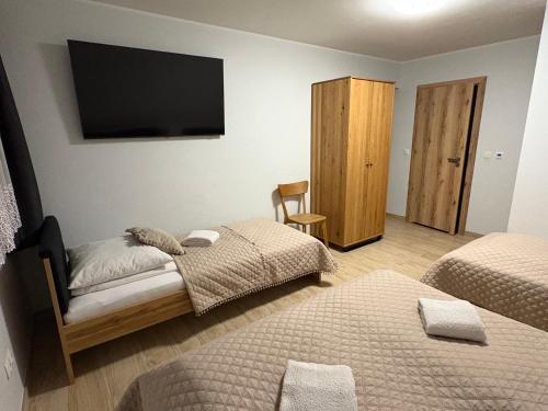 Postel nebo postele na pokoji v ubytování Apartament Miś