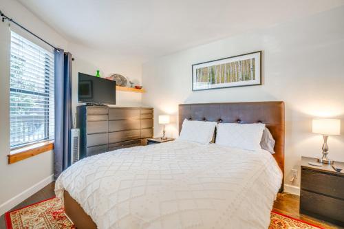 a bedroom with a large bed and a television at half Mi to Dtwn Frisco Mtn-View Condo with Pool! in Frisco