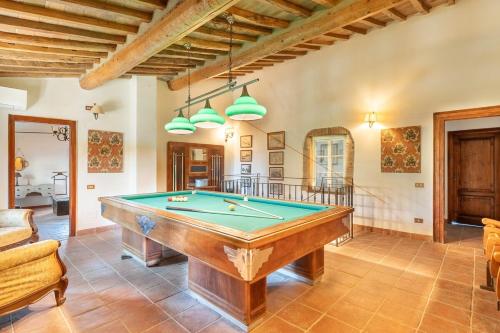 a living room with a pool table in it at Villa La Lespa W-Pool Biliardo and Lake View in Casa SantʼAndrea