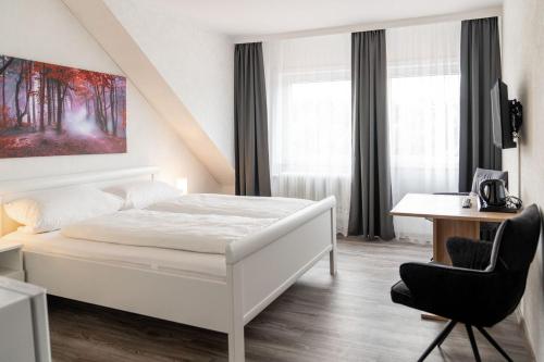 Una cama o camas en una habitación de Damhirsch