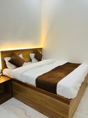 Postel nebo postele na pokoji v ubytování SITARAM Guest House