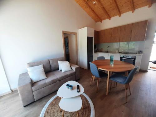 a living room with a couch and a table at Casas Peralta - Outeiro in Arouca