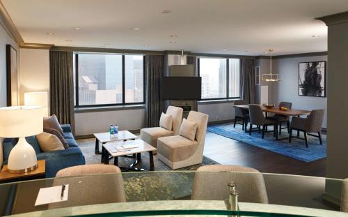 a living room with chairs and a table in a building at The Lofton Hotel Minneapolis, Tapestry Collection by Hilton in Minneapolis