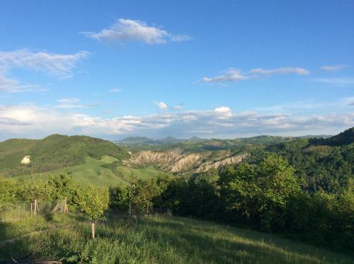 a view of a valley with mountains and trees at B&B Villa Rossana in Langhirano