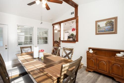 a dining room with a wooden table and chairs at 4-BD 3-FullBA SAMedical Cen,Riverwalk,Fiesta,Rodeo in San Antonio