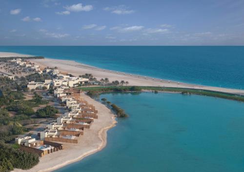 an aerial view of a beach with a resort at Anantara Sir Bani Yas Island Al Yamm Villa Resort in Da‘sah