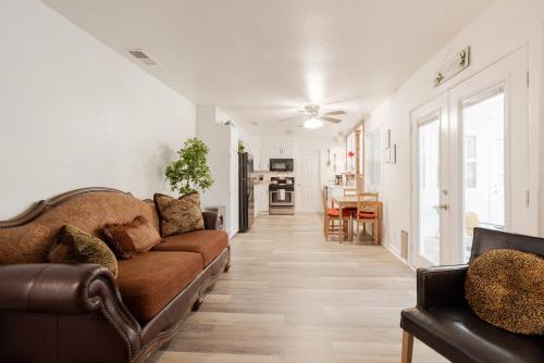 a living room with a couch and a table at 4-BD 3-FullBA SAMedical Cen,Riverwalk,Fiesta,Rodeo in San Antonio