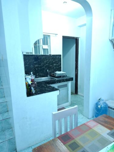 a kitchen with a sink and a counter top at Townhouse near SM LIPA in Tambo