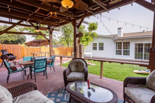 a patio with couches and a table and chairs at 4-BD 3-FullBA SAMedical Cen,Riverwalk,Fiesta,Rodeo in San Antonio