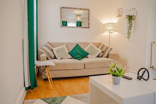 a living room with a couch and a table at Classy Southampton city center apt with free parking in Southampton