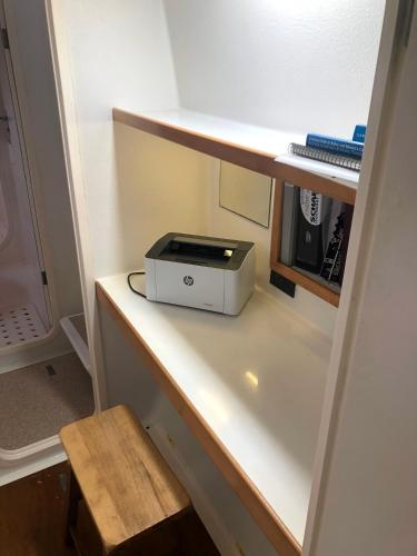 a microwave sitting on a shelf in a refrigerator at bocas Del toro Charter in Bocas del Toro