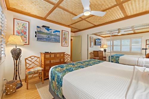 Postel nebo postele na pokoji v ubytování Kihei Kai Oceanfront Condos