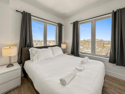 Ένα ή περισσότερα κρεβάτια σε δωμάτιο στο Apartmint at Fishtown - Philadelphia