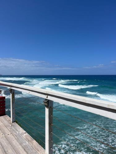 a view of the ocean from a pier at The Sea Cliff Hotel Resort & Spa in Port Antonio