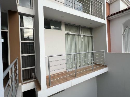 a balcony of a building with a staircase at Apartamento Miraflores country club in Piura