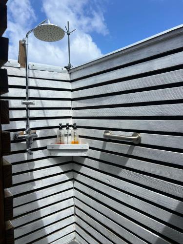 a bathroom with a sink on a wall at The Sea Cliff Hotel Resort & Spa in Port Antonio