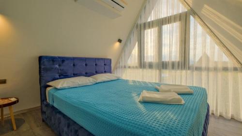 Ένα ή περισσότερα κρεβάτια σε δωμάτιο στο Villa Paradise Deluxe