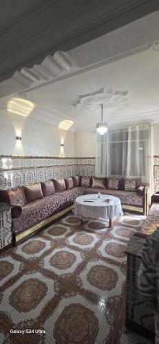 a living room with a couch and a table at Dar Tetuan 4 You III in Tétouan