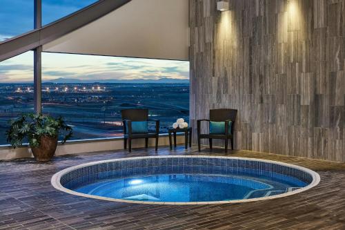 a hot tub in a room with a view at The Westin Denver International Airport in Denver