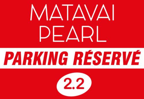 a red sign with the words marawi pearl parking reserve at Matavai Two in Papeete