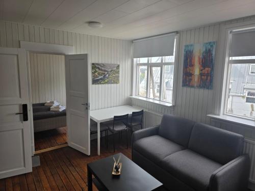 a living room with a couch and a table at City Guesthouse in Reykjavík