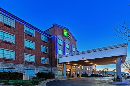 a hotel with a sign on the side of a building at Holiday Inn Express & Suites Tulsa S Broken Arrow Hwy 51 by IHG in Broken Arrow