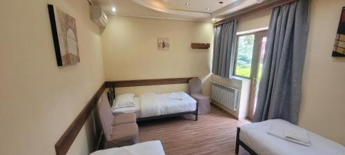 Postel nebo postele na pokoji v ubytování DALLAR Guest House