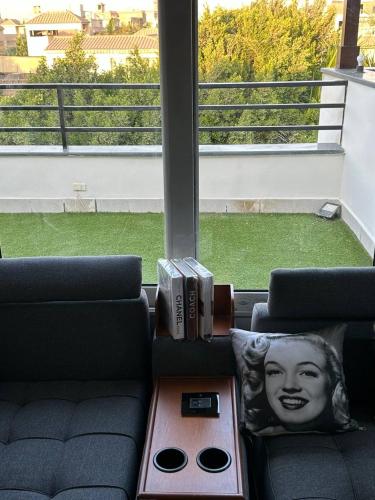 a living room with two couches and a table with books at Mirage residence resort in Cairo