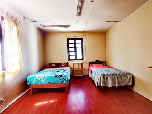 Letto o letti in una camera di La Posada del Misti II hospedaje