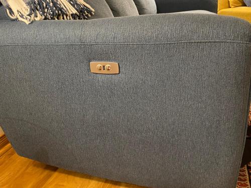 a gray couch with the number on it at Country Roads Dwelling in Dundas