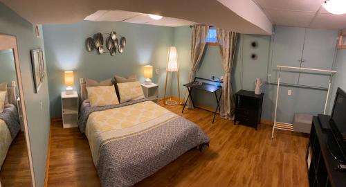 a bedroom with a bed and a desk in it at Country Roads Dwelling in Dundas