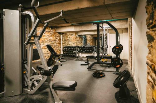 a gym with several treadmills and cardio machines at NEW Cozy Downtown Halifax Loft Free Parking in Halifax