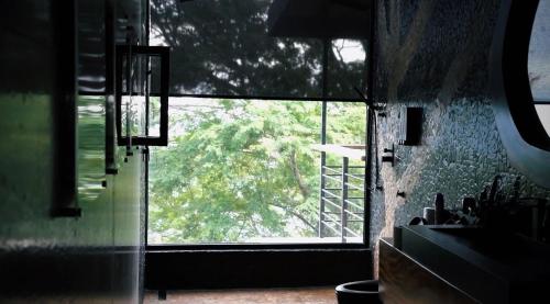 a kitchen with a large window in a room at Villa Cielo Sueños in Carrillo