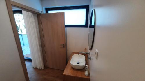 a bathroom with a white toilet in a room at Casas Peralta - Outeiro in Arouca
