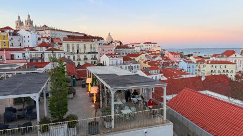 a view of a city with red roofs and buildings at Asian Everest House in Lisbon