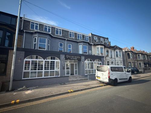 a white van parked in front of a building at Elite Hotel Blackpool in Blackpool