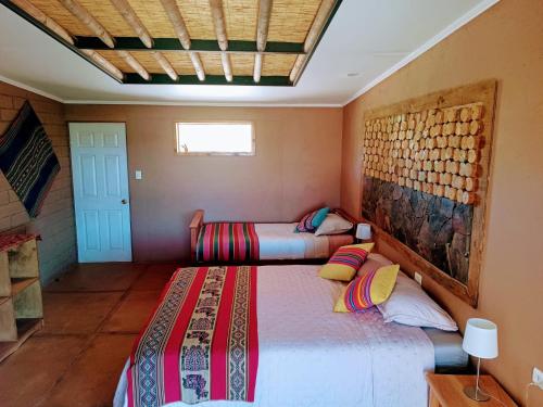 Ένα ή περισσότερα κρεβάτια σε δωμάτιο στο Tiunur Lodge
